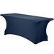 A navy blue Snap Drape spandex table cover on a table.