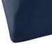 A navy blue Snap Drape spandex table cover on a table.