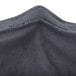 A charcoal spandex Snap Drape contour table cover with a zipper.