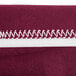 A burgundy Snap Drape contour table cover made of spandex fabric.