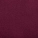 A close up of a burgundy Snap Drape spandex table cover.