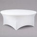 A white Snap Drape Contour spandex table cover on a round table.