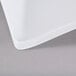 A close up of a white fabric contour table cover.