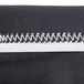 A close up of a black Snap Drape Contour spandex table cover with white stitching.