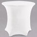 A white Snap Drape spandex table cover on a round table.