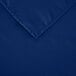 A square royal blue polyester cloth table cover with a hemmed edge.