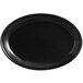 A black oval Tuxton china platter with a rim.