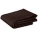 A folded brown table cover with a hemmed edge on a white background.