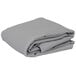 A stack of folded gray rectangular Intedge table covers.