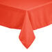 An orange Intedge square table cover on an outdoor table.