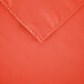 A close-up of an orange rectangular cloth table cover.
