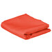 A folded orange rectangular table cover on a white background.