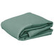 A stack of folded seafoam green Intedge rectangular table covers.