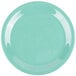 A close-up of a GET Rainforest Green melamine plate with a white narrow rim with a blue and white circle.