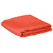 A folded orange rectangular table cover.