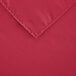 A hot pink rectangular Intedge table cloth with a corner.