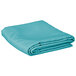 A folded teal rectangular table cover on a white background.