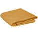 A folded round gold cloth table cover.