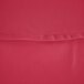 A close-up of a hot pink hemmed table cover.