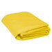 A folded yellow Intedge cloth table cover on a white background.