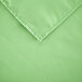 A square seafoam green polyester hemmed cloth table cover.