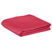 A folded hot pink Intedge table cover.