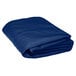 A folded royal blue Intedge table cover.