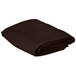 A folded brown Intedge square table cloth on a white background.