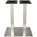 A pair of metal rectangular table bases with black square pedestals.