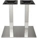 A pair of brushed stainless steel rectangular table bases with double columns.