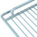 A white coated metal wire shelf with handles on the sides.