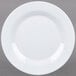 A white Minski melamine plate with a textured rim.