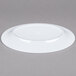 A white Minski melamine oval platter with a textured rim.