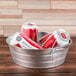 An American Metalcraft galvanized metal tub filled with cans of beer.