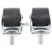A pair of Master-Bilt swivel stem casters with black rubber wheels and metal nuts on the stems.