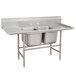 An Advance Tabco stainless steel two compartment pot sink with two drainboards.