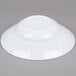A white Minski melamine bowl on a gray surface.