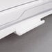 A close up of a white Rubbermaid ProSave rotating lid.