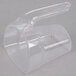 A clear plastic container with a long handle and a white rotating lid with a scoop inside.