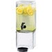 A Cal-Mil acrylic beverage dispenser with lemon slices inside.