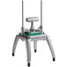 A metal Nemco Easy Chopper III with a green handle.