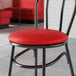 A red chair with a red vinyl seat for hairpin chairs.