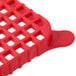 A close up of a red plastic basket with holes.