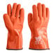 A close-up of a pair of orange Cordova Freezer Gloves.