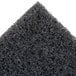 A close up of a black sponge.