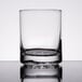 A close-up of a Libbey Nob Hill double old fashioned glass on a table.