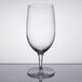 A clear wine goblet with a clear stem and base and a white rim.