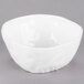 A white bowl with a small crack in it.