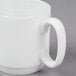 A 10 Strawberry Street white bone china coffee cup with a handle.