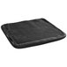 A black cushion with a black cover on top.